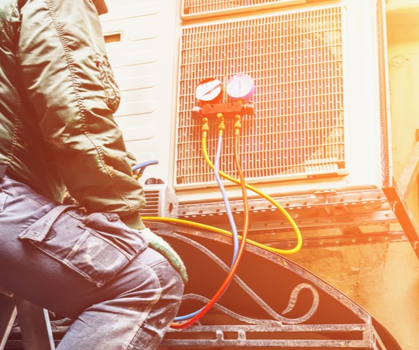 technician working AC unit repair