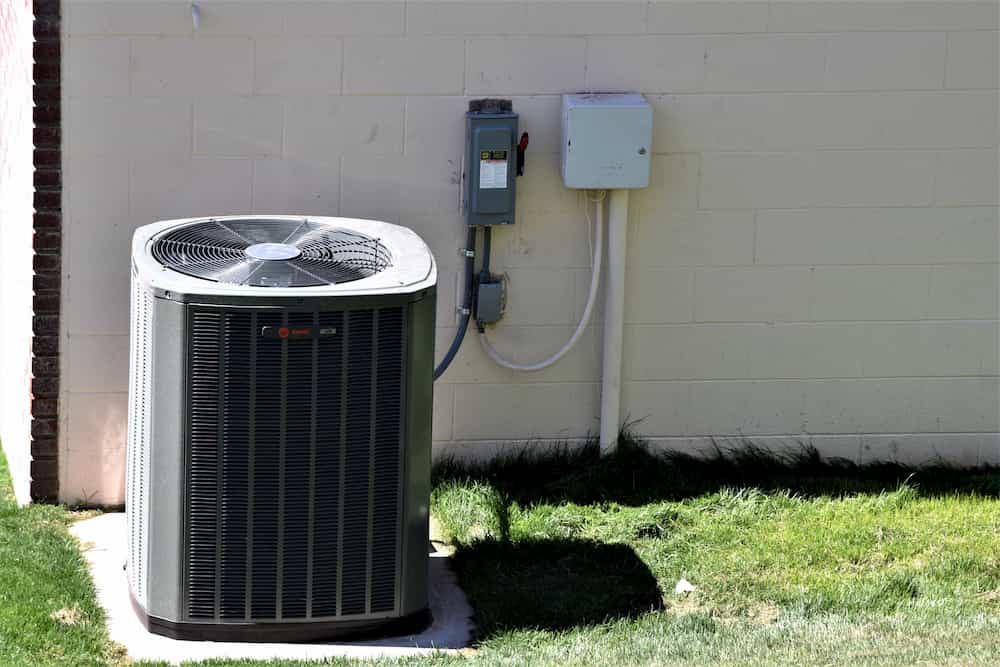 Common Misconceptions About Air Conditioning in Arizona outdoor air conditioning unit next to wall